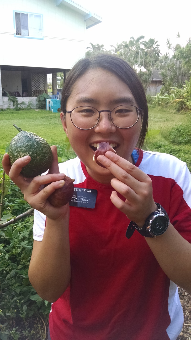 Sister Yeung is also holding a Tangelo. I think it is a cross between a Tangerine and an Orange.