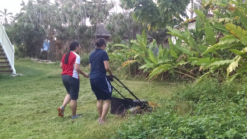 Sister Furukawa mowing the lawn.