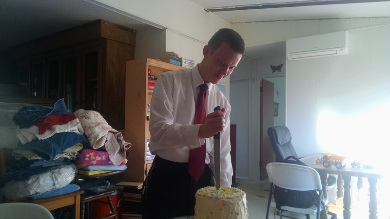 He was having a bit of trouble cutting into the cake.