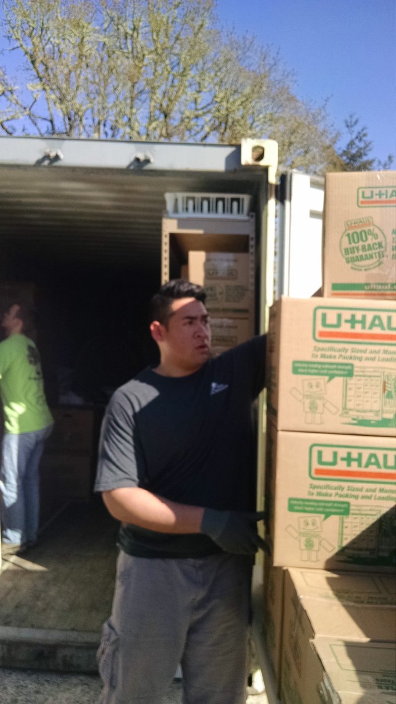 Elder Falatea and Elder Enman helped us unload Lois's container. Elder Falatea would carry three boxes at a time.