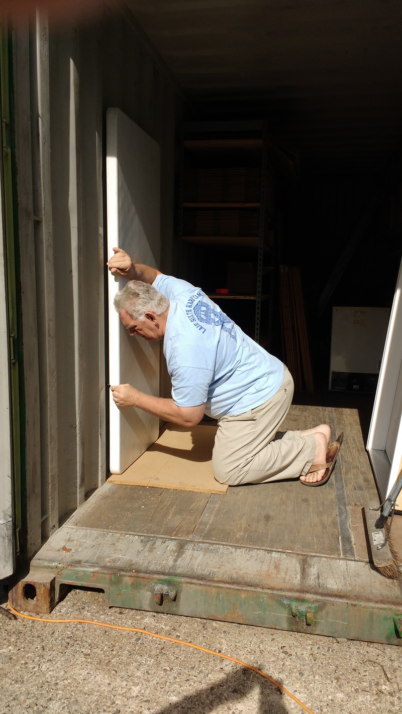 Measuring and marking the door placement.