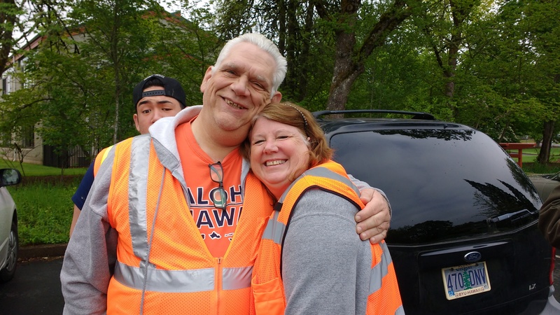 Don and Lois Colton met others for the roadside service project. Elder Falatea is in the background.