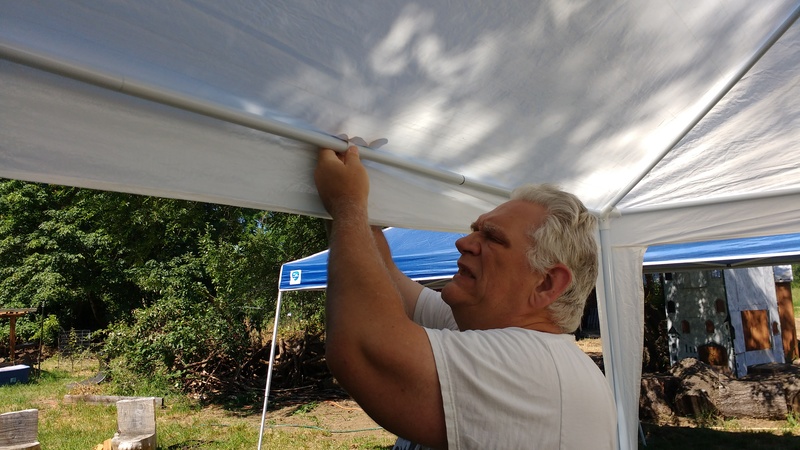 Putting on the tarp.