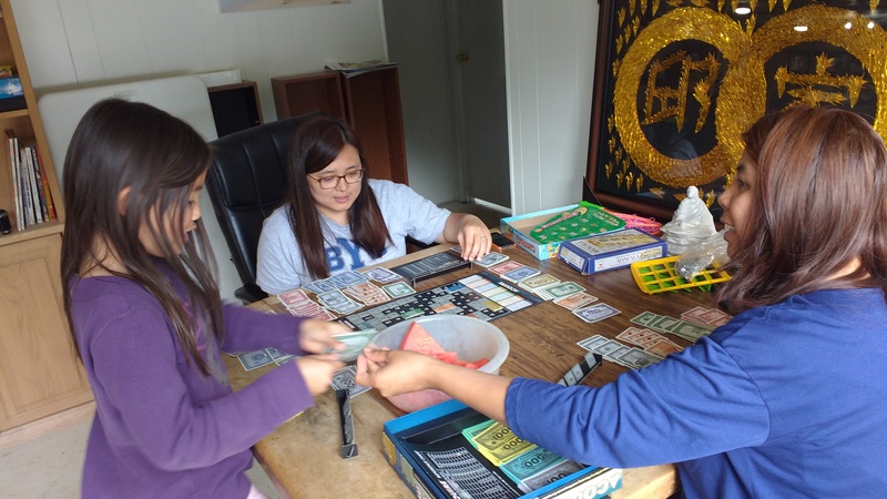 Eva, Jean, and Ann play Acquire.