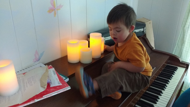 Calvin enjoys the candles.