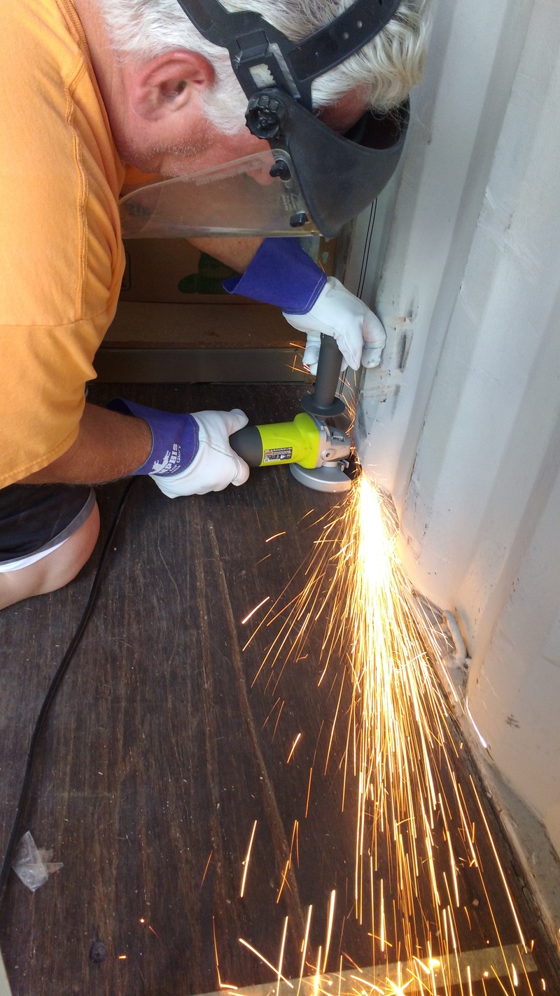 Don cutting Lois's container door.