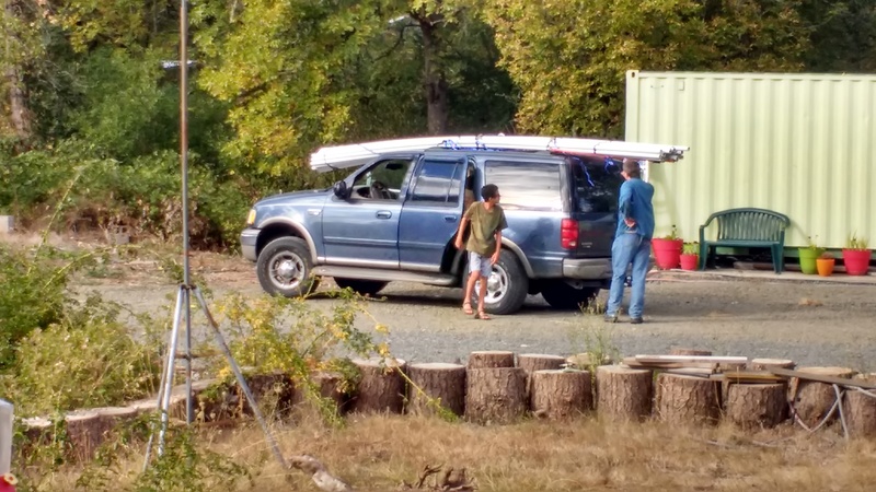 Joseph and Mikey unload 29 sticks of 1.5x20 PVC for our water system.