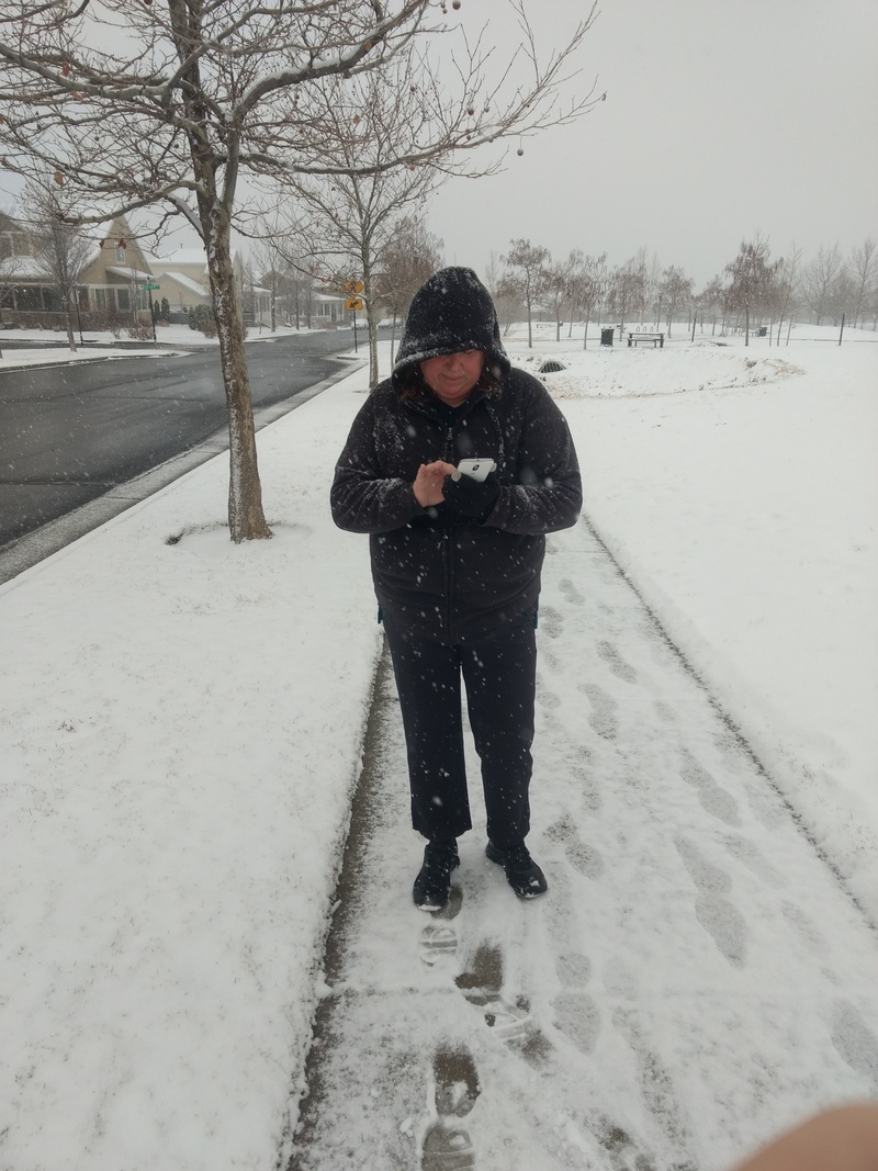 Lois playing Pokemon Go.