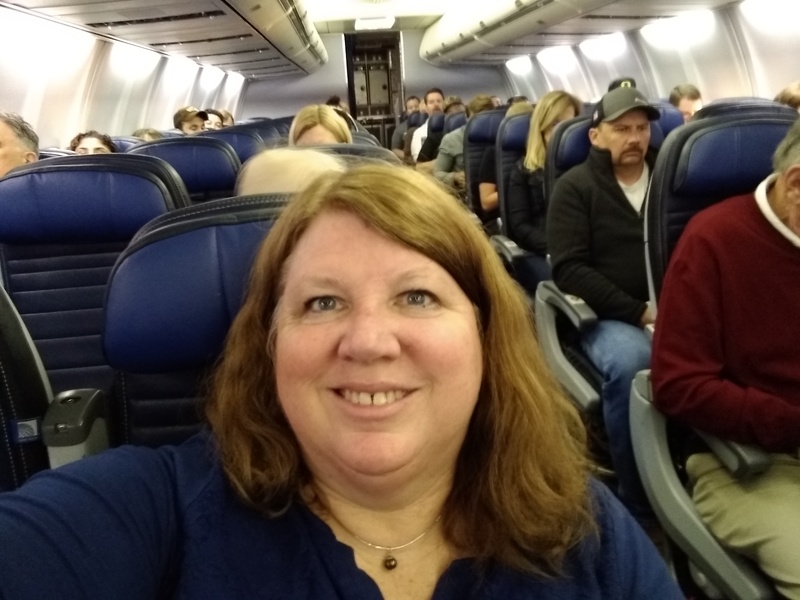 Mon 06:34 Lois in her seat headed to Denver.