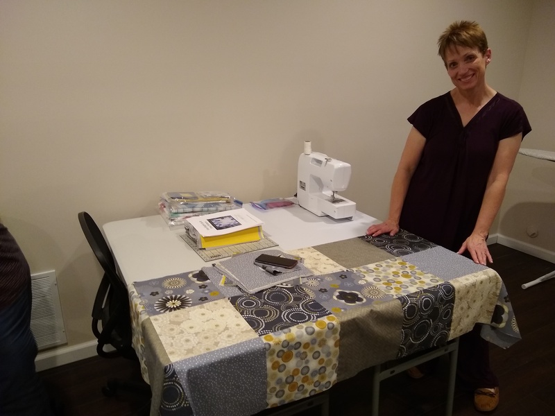 Kelli showing off her quilt.