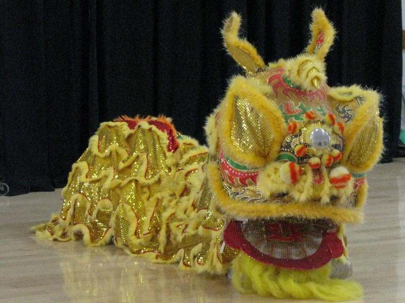 The Hong Kong club brought a lion who danced for the luncheon.