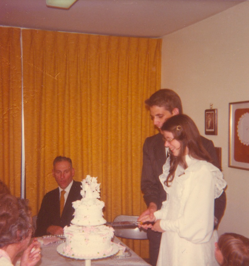 Don and Lois cutting cake. Herb Pedersen in background.