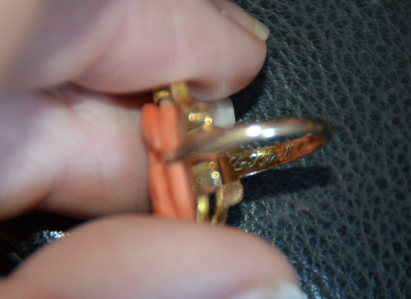 Conrad often gave Esther jewelry with her initials on it. After careful zooming and consideration, I think this ring is engraved with C S to E O.