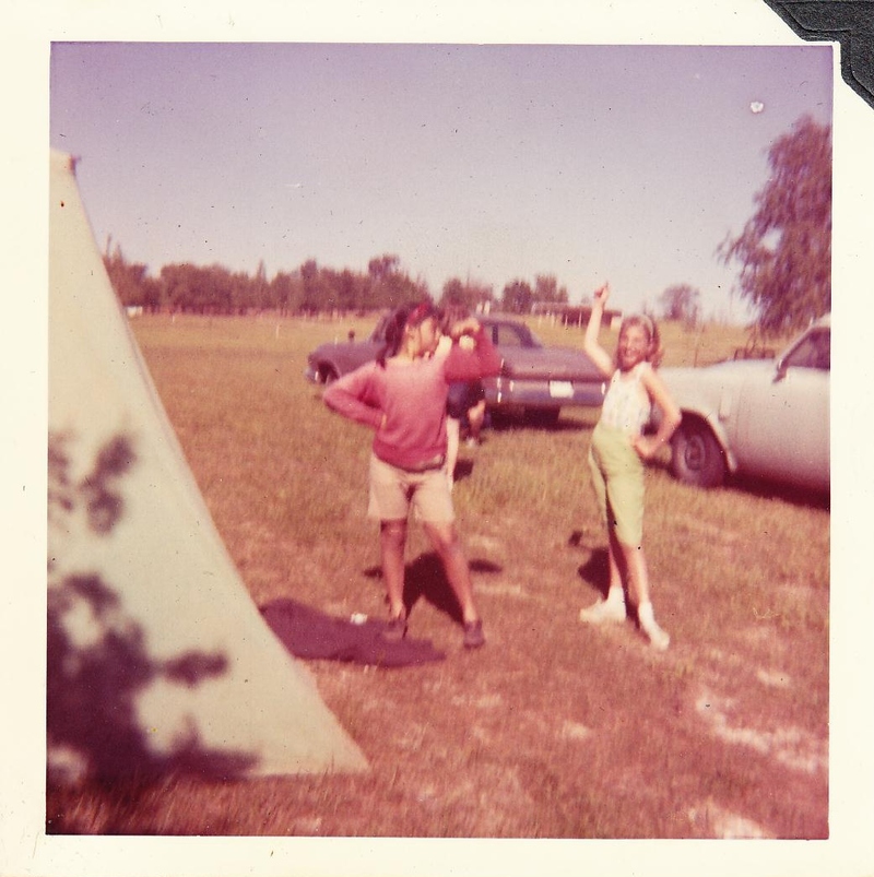 Betty Deer and Dee Zeitler posing while camping. Our tent and green studie are in the photo also.