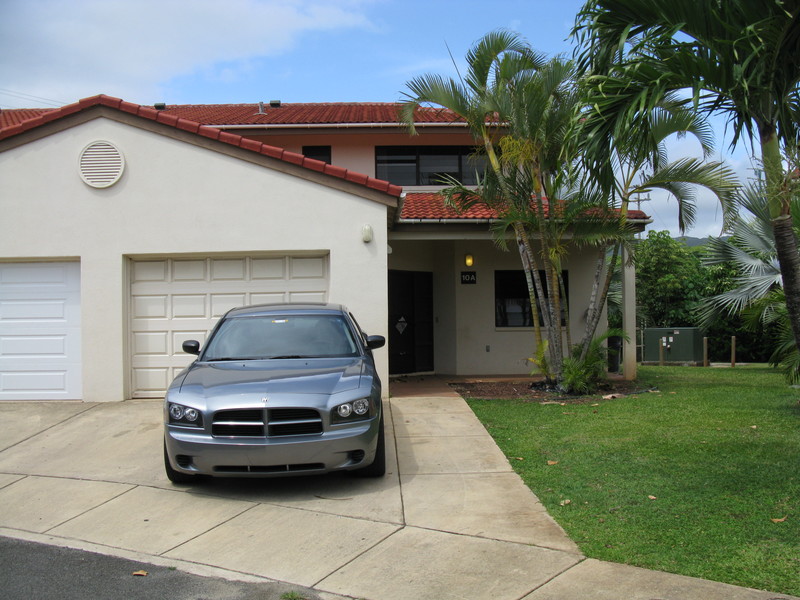 Here is your townhouse with someone's car in the driveway. You can park one in the garage (tight fit) one in the driveway, and the rest in the culdesac with the other neighbors.