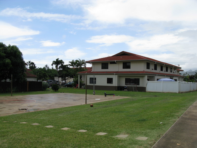 Basketball court and building 9 with culdesac in background.