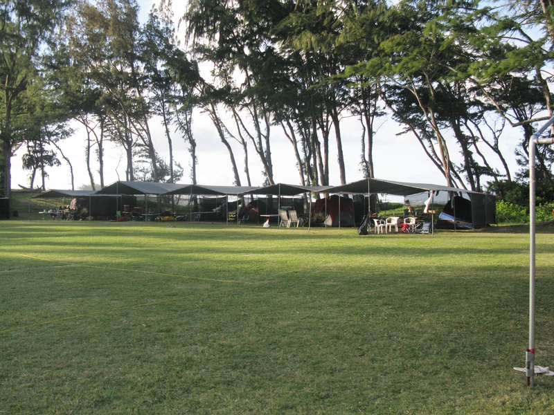Most families put up "easy corners" and then tents underneath. This helps protect the site from wind and rain.