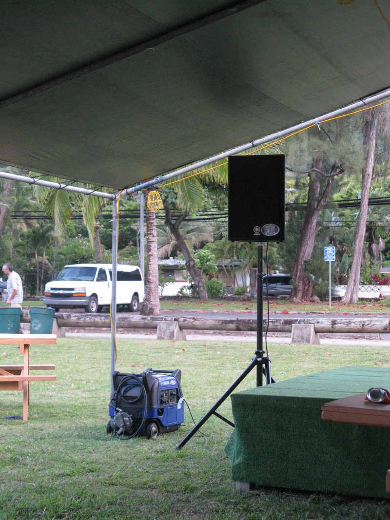 Notice the PA system in the main tent, which also has a fake carpeted platform.