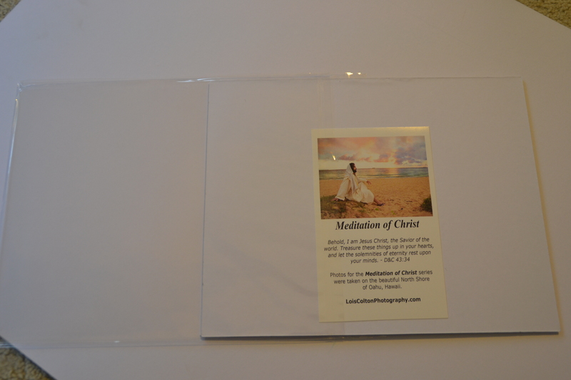 Step 4: Slide the mats and pictures into a plastic sleeve so that the closure is on the back.