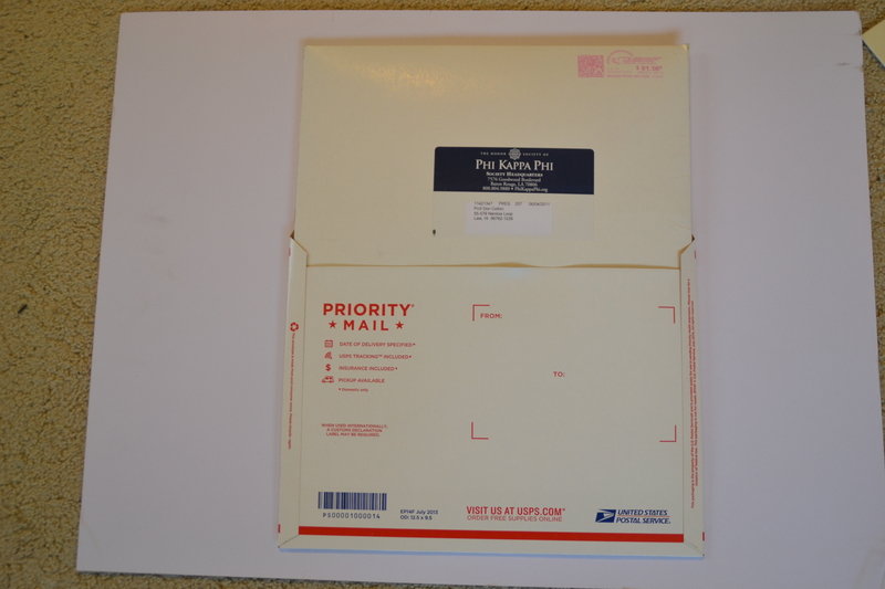 Slide the mailing envelop into a "flat rate" envelope if it weighs/costs more than just sending the mailing envelope. This sample has three mats inside. If someone only ordered one picture it would probably cost less than a flat rate envelope. I need to check if the mailing envelope can go faster like priority.