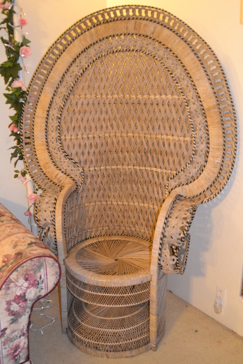 It is called a Peacock Chair and you can tell it's rather large.