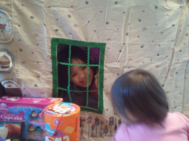 Eva in, Adele outside playing together.