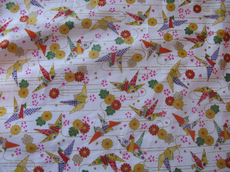 Here's a close up of the second fabric. It has origami cranes all over. When Min Zhi and David were married some friends and David made a picture using 1000 golden cranes.