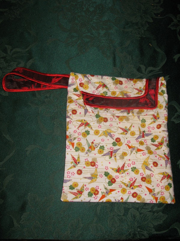 Here's the bag that the nursing cover, diapers, wipes, pads, go in.