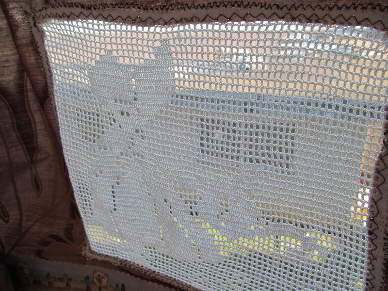 Right Side, Looking out the "window" at the girl watering the garden.